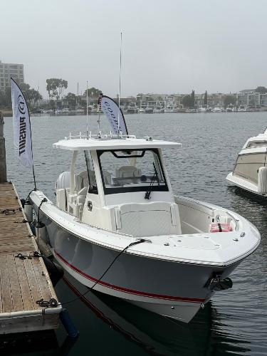 Pursuit S 328 Sport 2025 Pursuit S 328 Sport boat docked in marina.