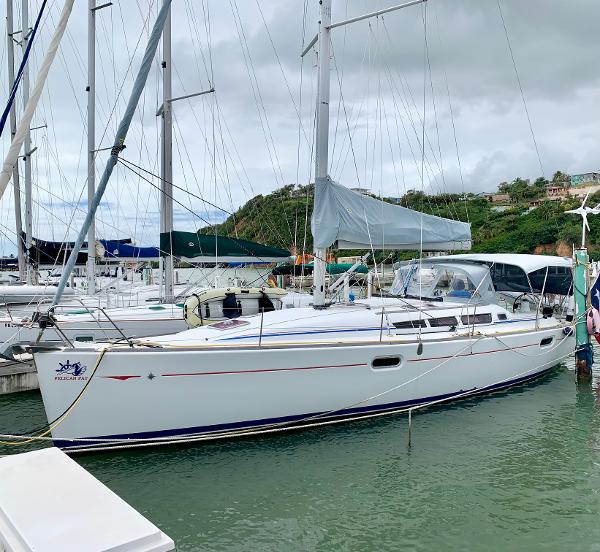 Jeanneau Sun Odyssey 42i 2010 Jeanneau Sun Odyssey 42i sailboat docked in a marina.