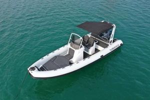 Highfield Sport 700 2025 Highfield Sport 700 boat on clear water, featuring sleek design and canopy.