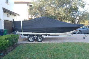 Scout 251 XSS 2018 Scout 251 XSS boat covered on trailer in residential driveway.