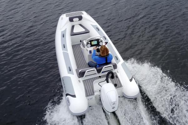 Highfield Sport 390 2025 Highfield Sport 390 boat cruising on water, rear view.