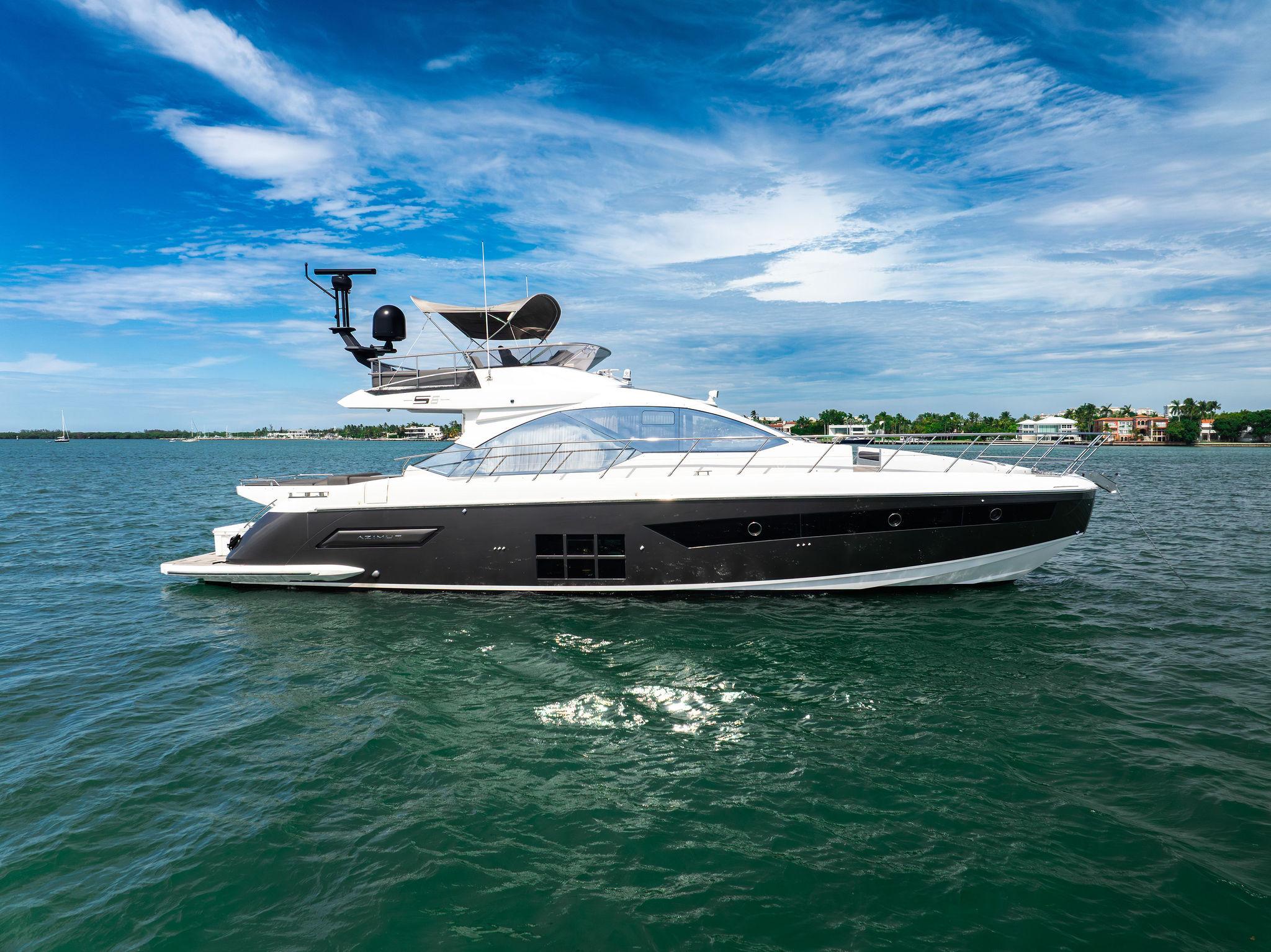 Azimut S6 2021 Azimut S6 yacht cruising on open water under a clear blue sky.