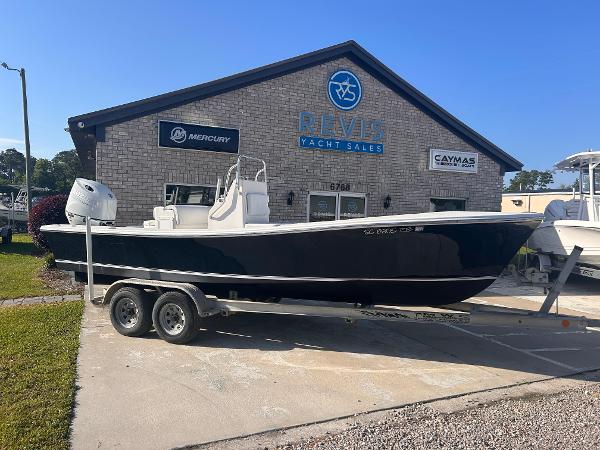 Privateer 21 CC 1988 Privateer 21 CC boat on trailer outside yacht sales building.
