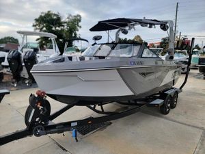 Nautique Super Air Nautique S21 2022 Nautique Super Air Nautique S21 boat on trailer, parked outdoors.