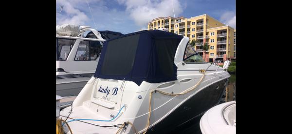 Rinker 350 Express Cruiser 2008 Rinker 350 Express Cruiser docked at marina with blue canvas cover.