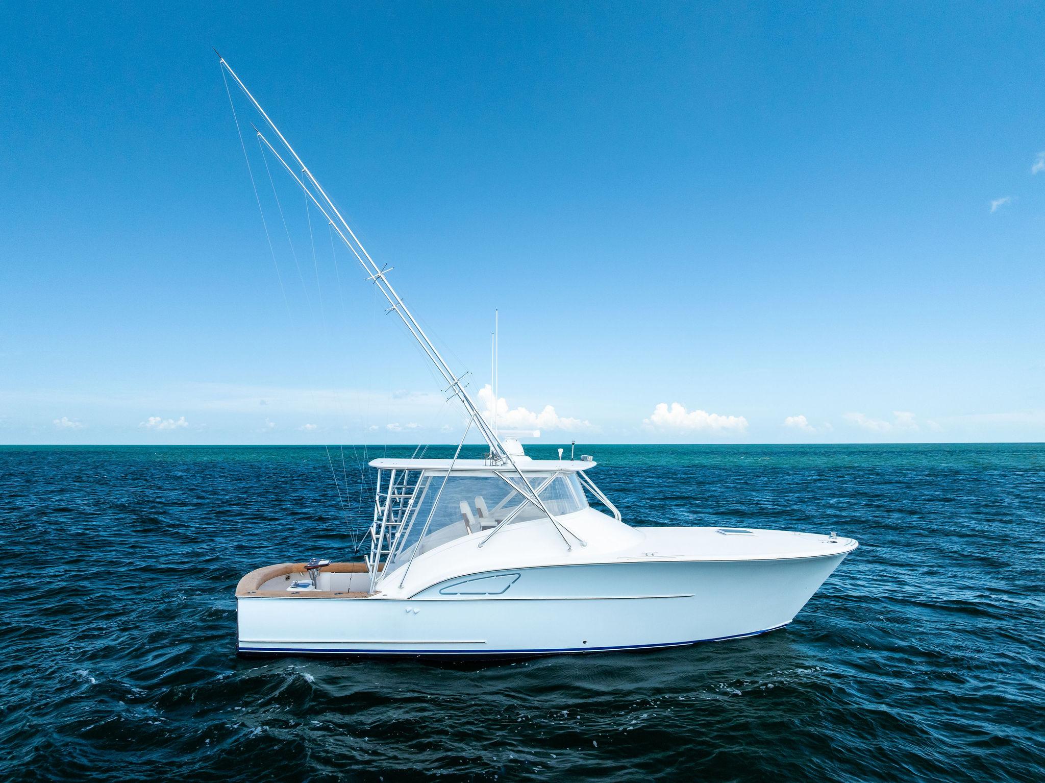 Custom Carolina 35 Express 2018 Custom Carolina 35 Express boat on open ocean under clear blue sky.