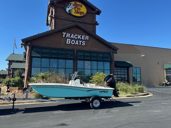 Mako Pro Skiff 15 CC 2025 Mako Pro Skiff 15 CC boat outside Bass Pro Shops Tracker Boats store.