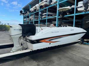 Hurricane 188 SunDeck Sport -OB 2021 Hurricane 188 SunDeck Sport CC-OB boat with Suzuki outboard motor in storage facility.