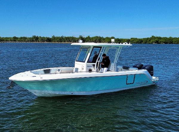 Robalo R272 Center Console 2021 Robalo 272 boat on calm water, clear sky, side view.