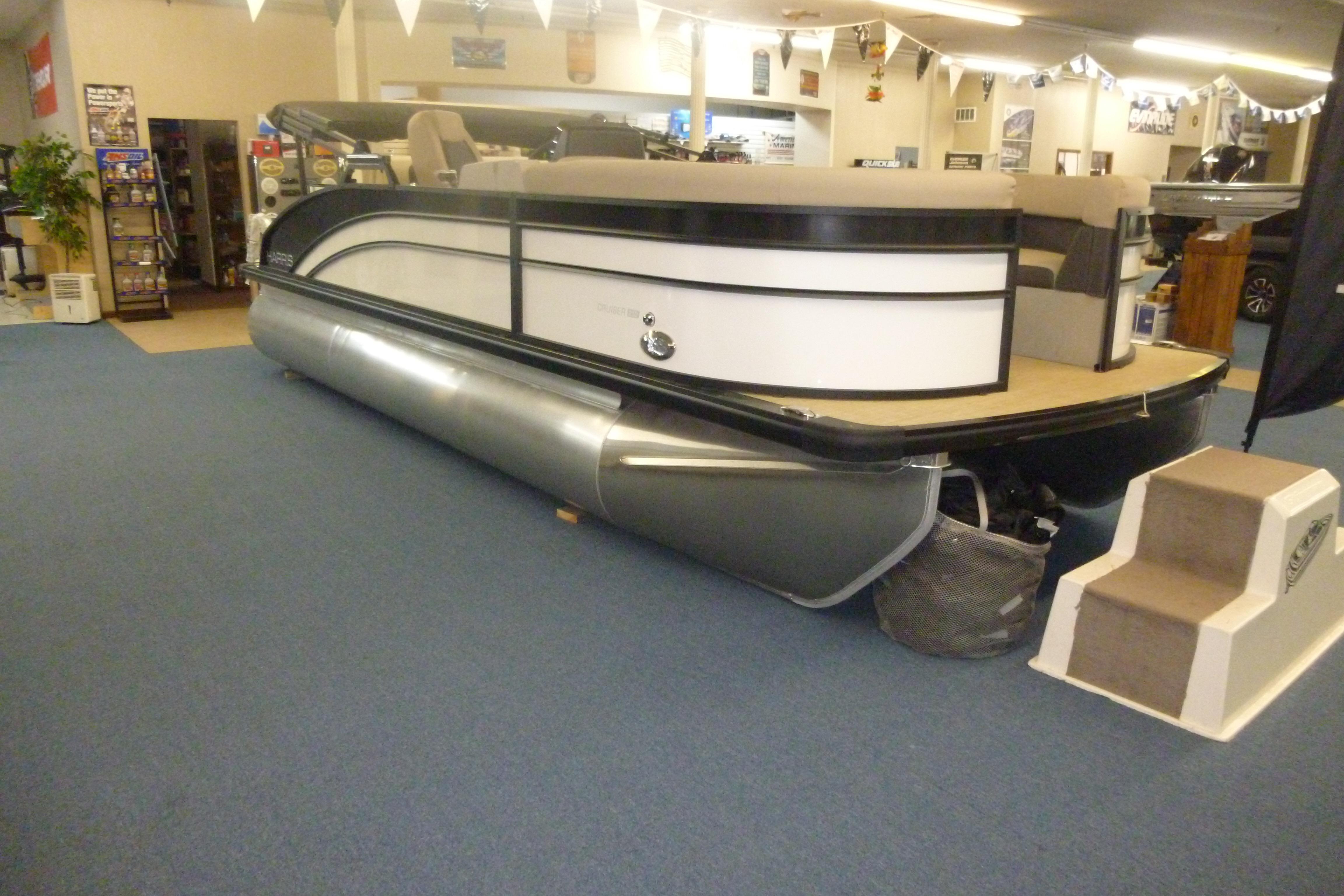 Harris Breese 210 2025 Harris Breese 210 pontoon boat displayed indoors on blue carpet.