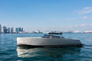VanDutch 40 2014 VanDutch 40 yacht on calm water with city skyline in background.