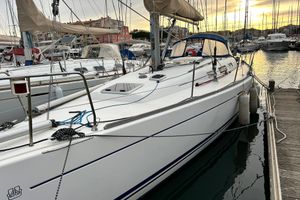Dufour 40 Performance Sailboat Dufour 40 Performance 2003 docked at marina during sunset.
