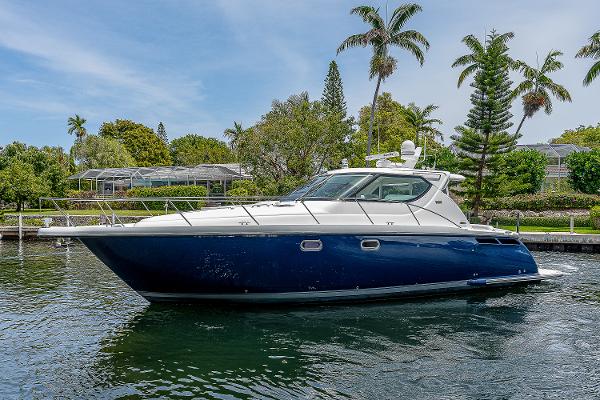Tiara Yachts 4300 Sovran 2007 Tiara Yachts 4300 Sovran cruising on a scenic waterway with lush greenery.