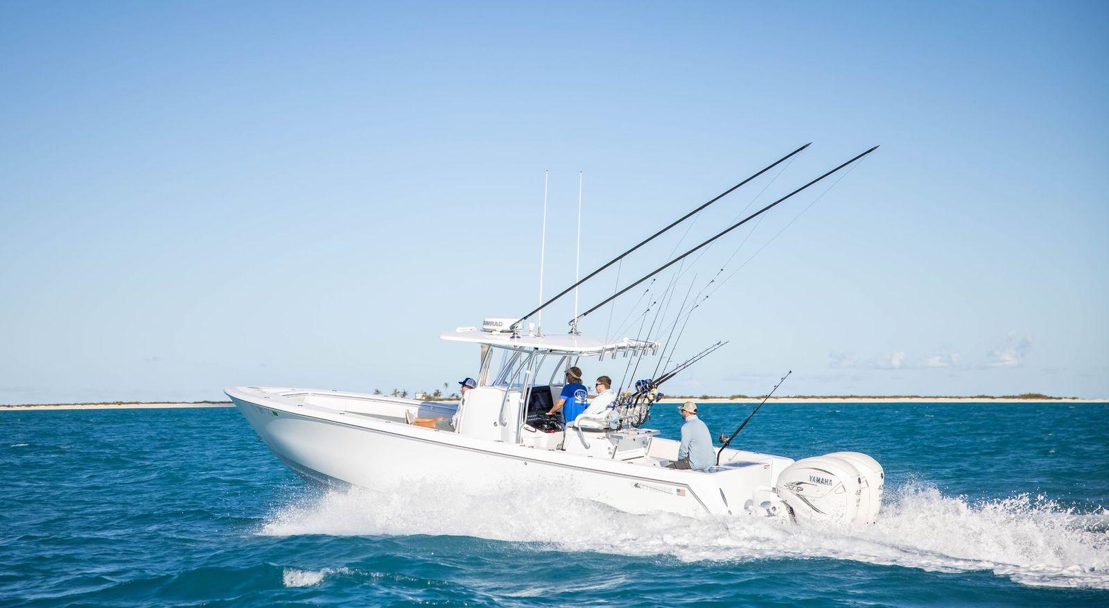 Contender 35ST 2026 Contender 35ST boat cruising on open water with fishing rods.