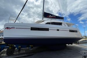 Leopard 40 2019 Leopard 40 catamaran on a trailer, under a cloudy sky.