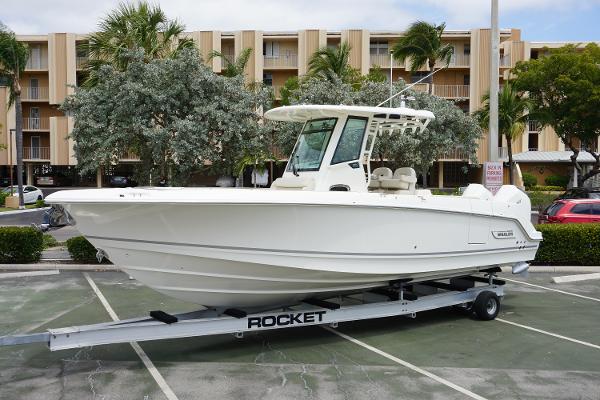 Boston Whaler 280 Outrage 2025 Boston Whaler 280 Outrage boat on trailer in parking lot.