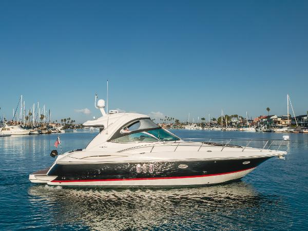 Cruisers Yachts 420 Express 2006 Cruisers Yachts 420 Express on calm water, with marina in background.