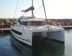 Bali CATSPACE 2021 Bali CATSPACE catamaran docked at a marina, featuring sleek design and spacious deck.