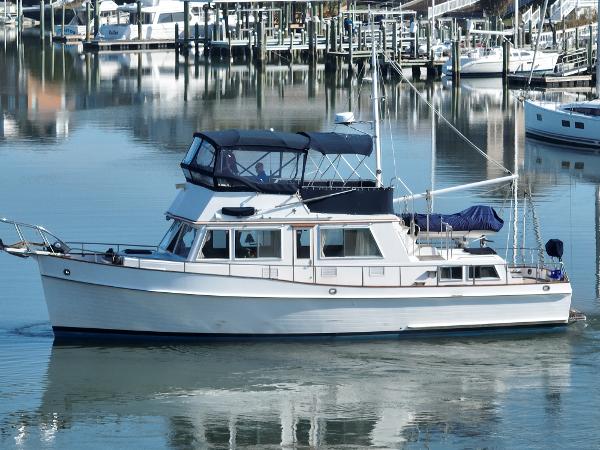 Grand Banks 42 Classic 1989 Grand Banks 42 Classic yacht docked in a serene marina setting.