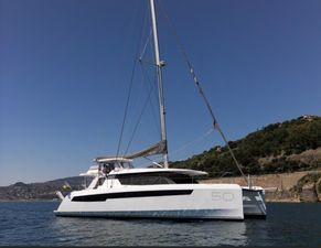 Robertson Leopard 50 2021 Robertson Leopard 50 catamaran sailing on calm waters near a scenic coastline.