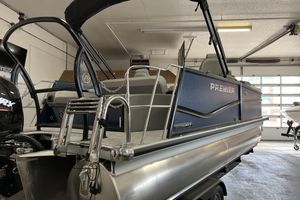 Premier Sunsation 210RL 2024 Premier Sunsation 210RL pontoon boat in a garage, showcasing sleek design and modern features.