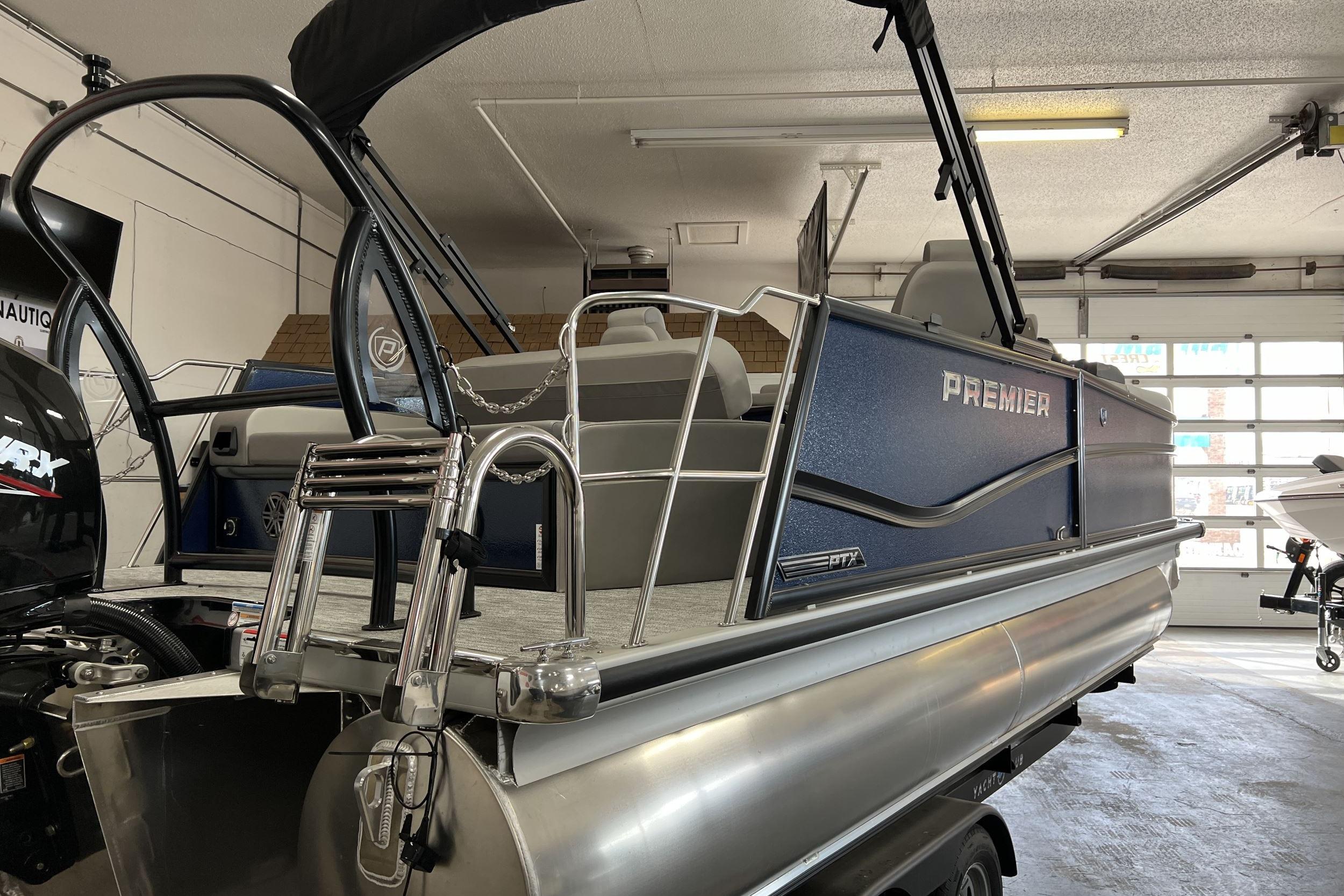 Premier Sunsation 210RL 2024 Premier Sunsation 210RL pontoon boat in a garage, showcasing sleek design and modern features.