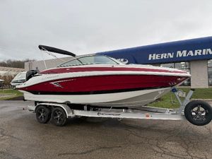 Crownline Eclipse E240 XS 2024 Crownline Eclipse E240 XS boat on trailer outside Hern Marine dealership.
