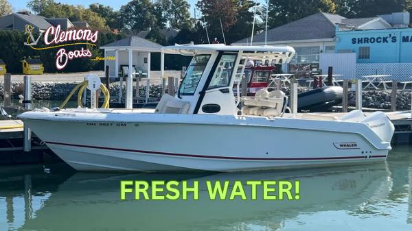 Boston Whaler 250 Outrage 2024 Boston Whaler 250 Outrage boat docked in fresh water at Clemons Boats.