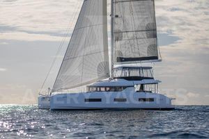 Lagoon 55 2024 Lagoon 55 yacht sailing on open water under a clear sky.