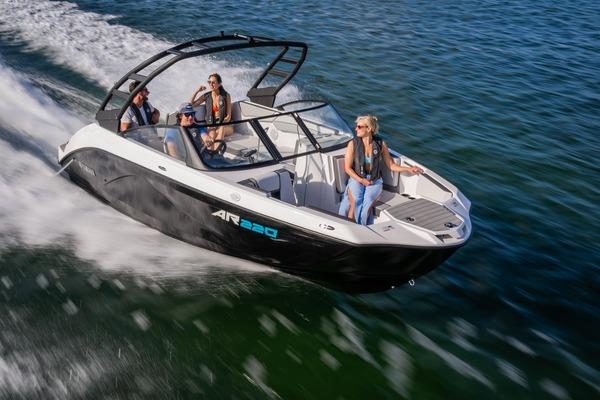 Yamaha Boats AR220 2026 Yamaha Boats AR220 speeding on water with passengers enjoying the ride.