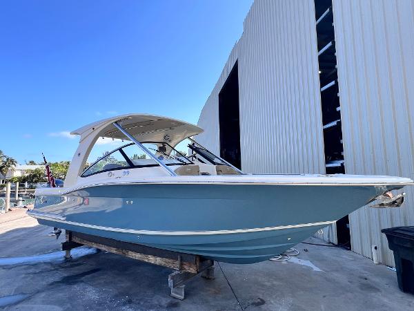 Scout 275 Dorado 2018 Scout 275 Dorado boat on display outside a large storage facility.