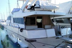 Ghibli Ghibli 19 1988 Ghibli 19 yacht docked at marina, rear view with covered equipment.