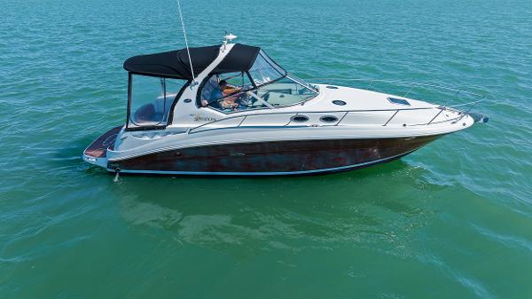 Sea Ray 320 Sundancer 2006 Sea Ray 320 Sundancer boat on calm water.