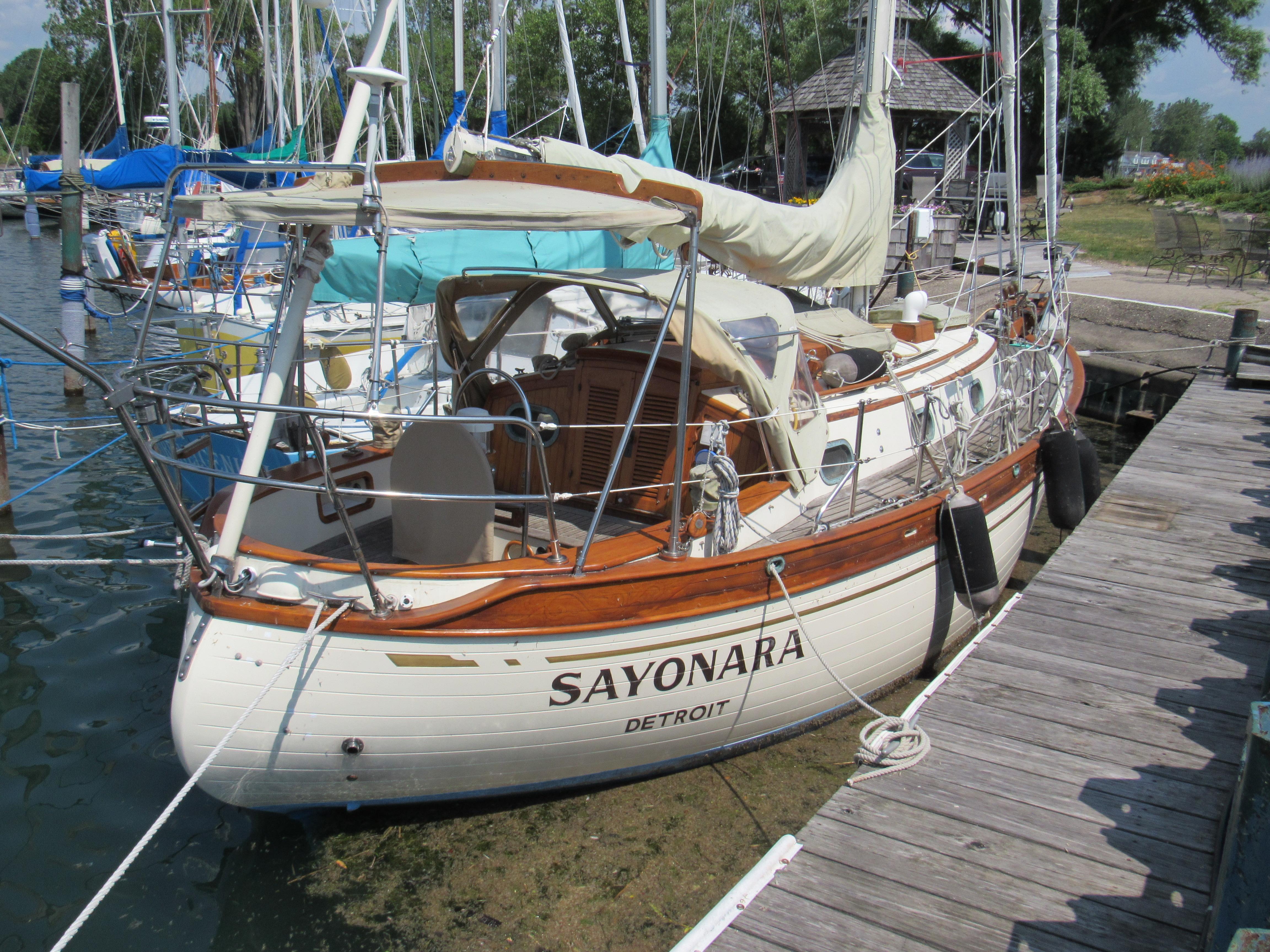 Baba 30 1981 Baba 30 sailboat named "Sayonara" docked at a marina, featuring wooden accents.