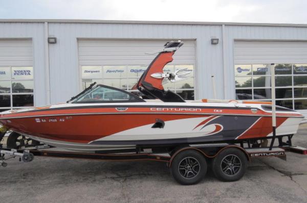 Centurion Enzo SV233 2016 Centurion Enzo SV233 boat on trailer, parked outside a dealership.