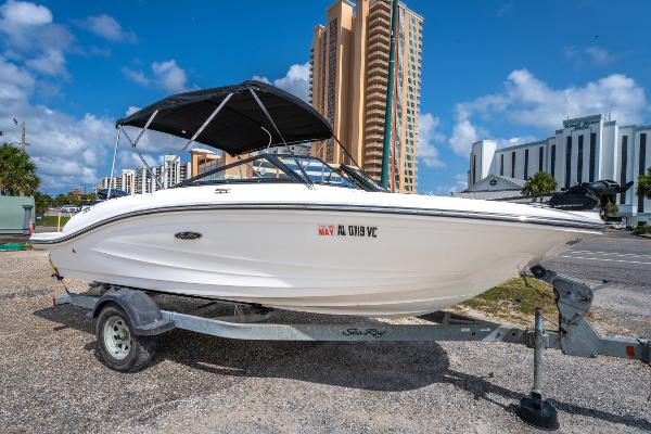 Sea Ray SPX 190 Outboard 2017 Sea Ray SPX 190 OB boat on trailer, cityscape background, sunny day.