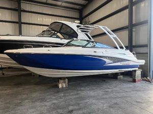 Monterey M4 2024 Monterey M4 boat in storage, featuring sleek blue and white design.