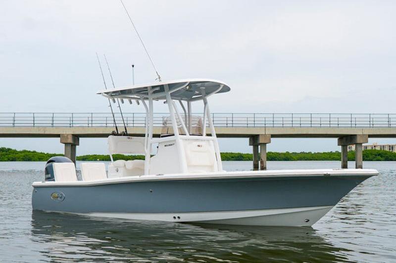 Sea Hunt BX 22 BR 2026 Sea Hunt BX 22 BR boat on water near a bridge.