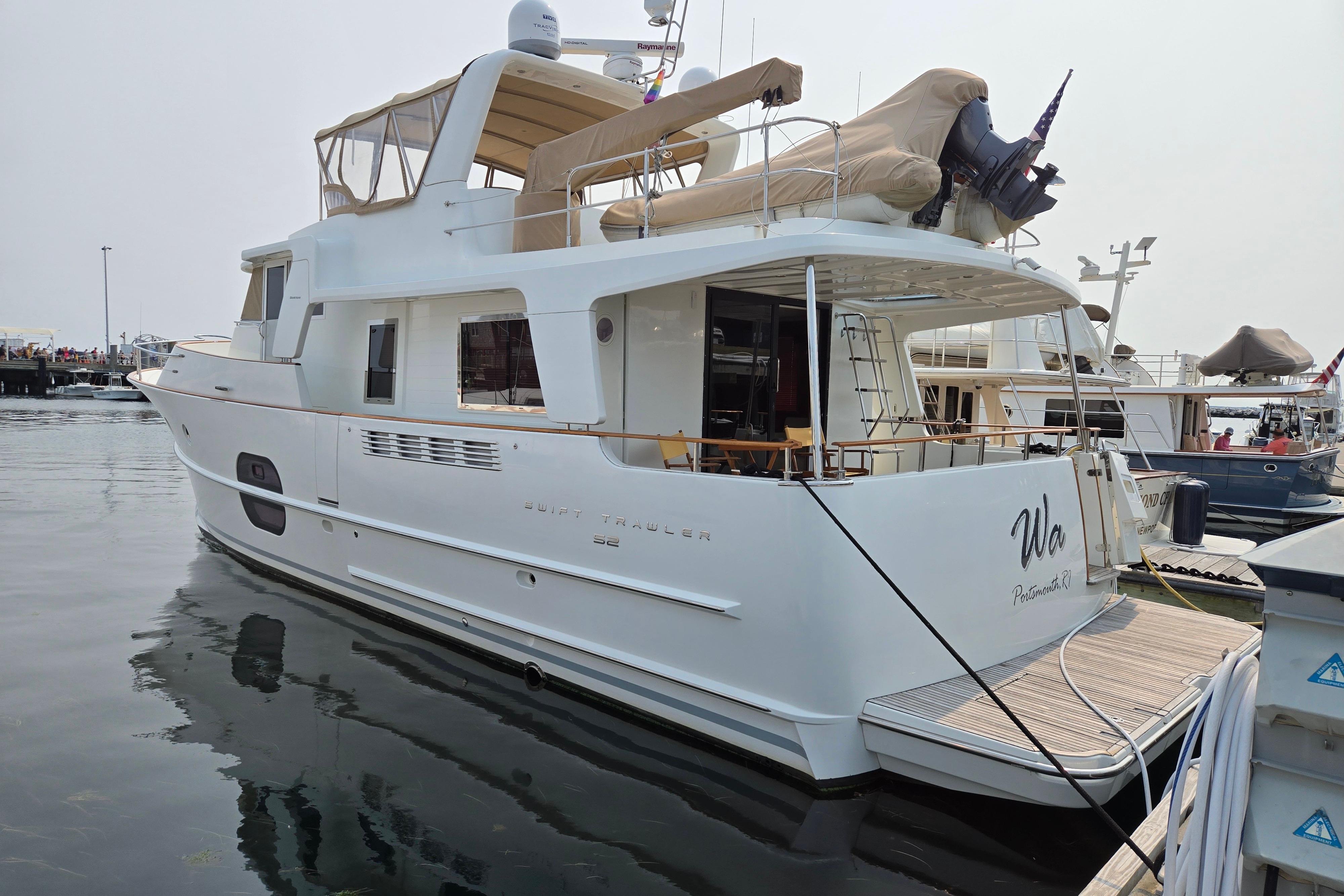 Beneteau Swift Trawler 52 2012 Beneteau Swift Trawler 52 docked at marina, featuring spacious deck and elegant design.