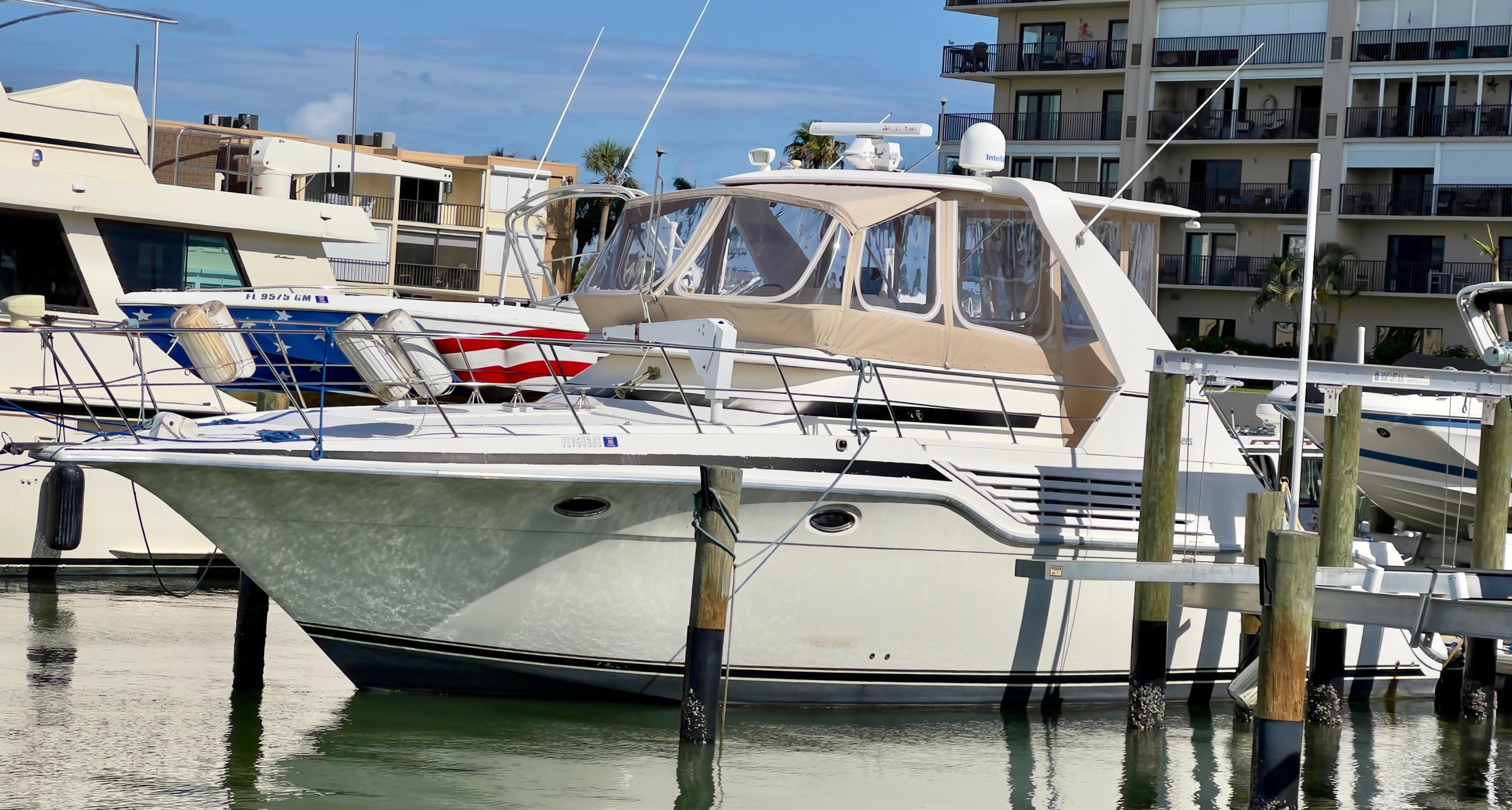 Cruisers Yachts 4285 Express Bridge 1996 Cruisers Yachts 4285 Express Bridge docked at marina, sunny day.
