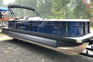 Barletta Aria 24QC 2024 Barletta Aria 24QC pontoon boat on trailer, side view.