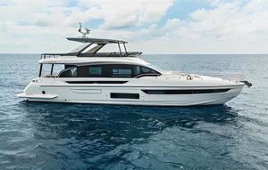 Azimut 72 FLY 2024 Azimut 72 FLY yacht cruising on open sea under cloudy sky.