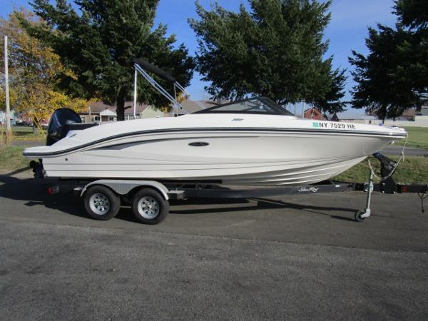 Sea Ray SPX 210 2021 Sea Ray 210 SPX boat on trailer, parked outdoors.