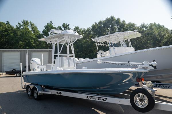 Contender 26 Bay 2025 Contender 26 Bay boat on trailer, parked outdoors.
