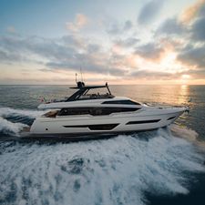 Ferretti Yachts 780 2024 Ferretti Yachts 780 cruising at sunset on open sea.