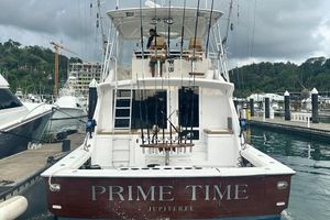 Bertram 60 Convertible 1998 Bertram 60 Convertible yacht docked, named "Prime Time," in a marina setting.