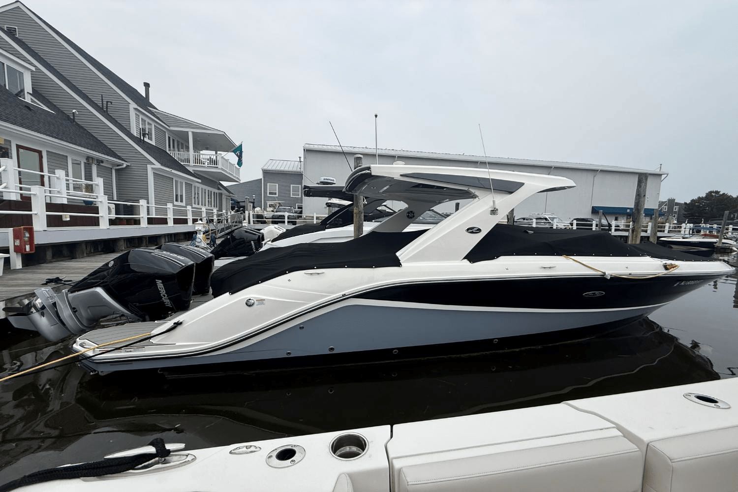 Sea Ray SLX 310 Outboard 2023 Sea Ray SLX 310 Outboard boat docked at marina.