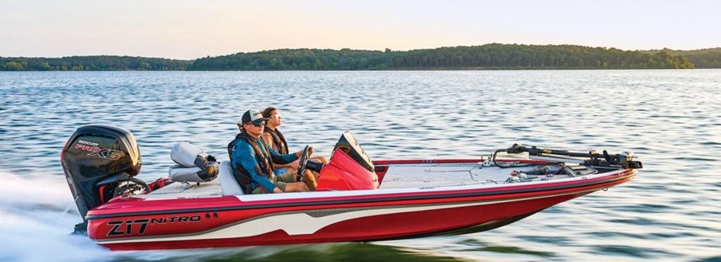 Nitro Z17 2026 Nitro Z17 boat speeding on a lake with two passengers.