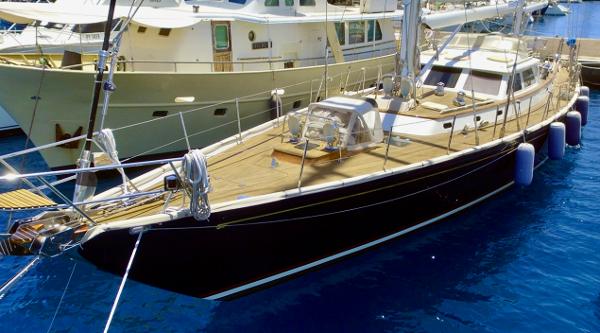 Hinckley Sou'wester 70 Hinckley Sou'wester 70 yacht, 1998 model, docked in a marina with clear blue water.
