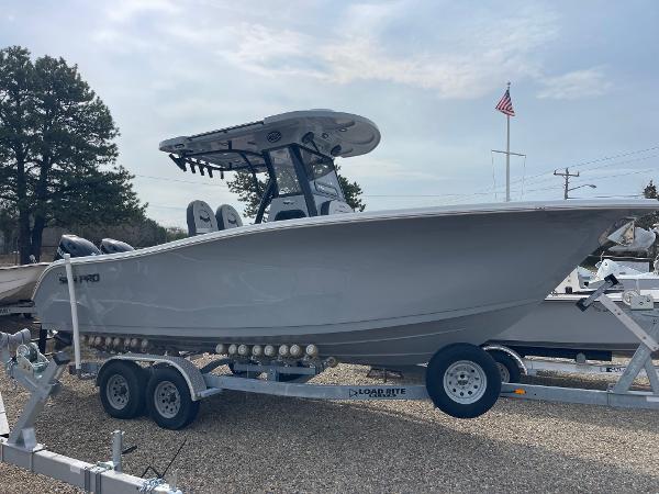 Sea Pro 262 Offshore 2025 Sea Pro 262 Offshore boat on trailer, parked outdoors under cloudy sky.